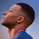 A tired Kylian Mbappé from FIFA 2022 looks toward the horizon.